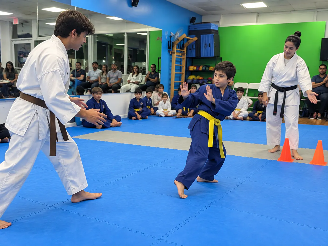 Child in a blue uniform stepping away to a safe zone during a distance safety drill